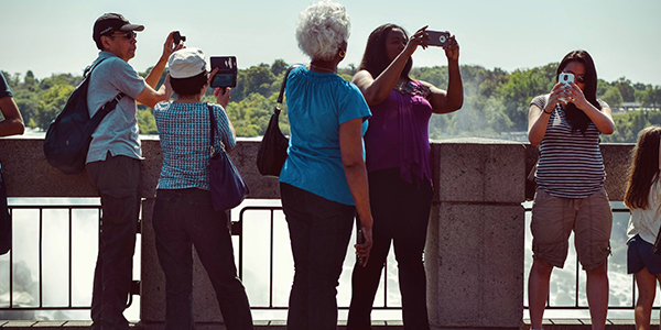 People photographing a landscape