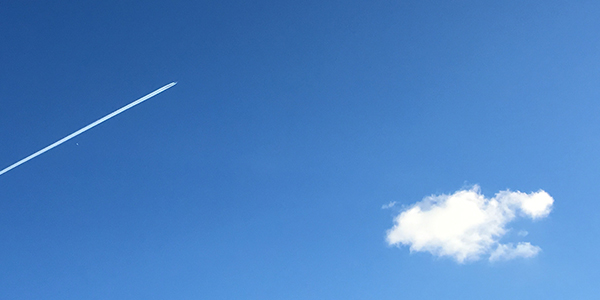 Sky with a plane and a cloud