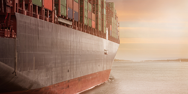 Cargo ship moored at sunset 