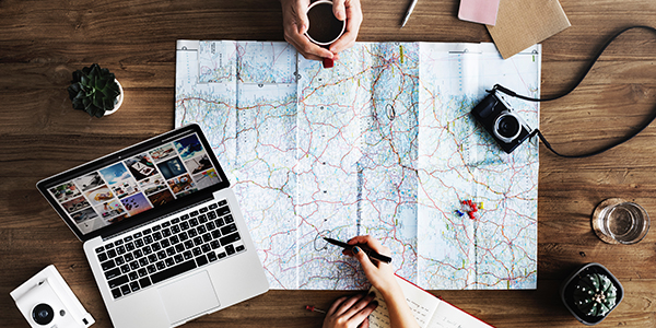 Woman drawing a circle on a map