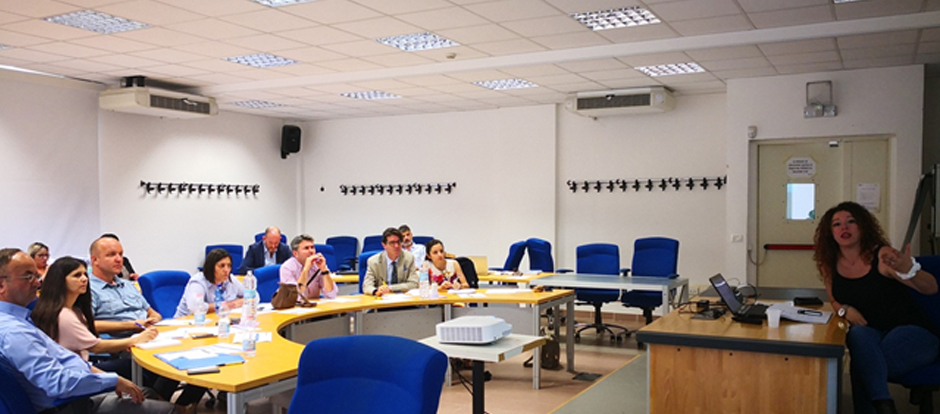 Occasion to meet partners and to present project objectives Woman talking during a meeting