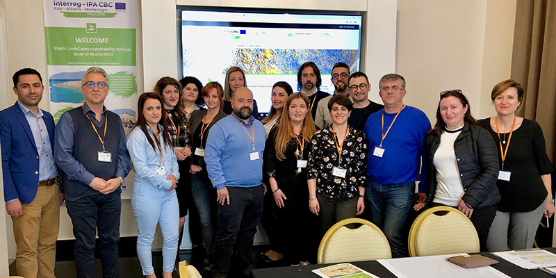 Intermediate Meeting of the project WELCOME people at a meeting taking a picture