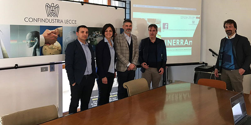 Confindustria Lecce met for an update on the activities people at a meeting taking a picture