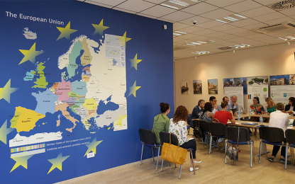 Meeting next to the map of the European Union