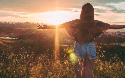 Woman watching the sun